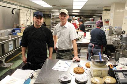 two men standing at kitchen counter